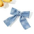 Close-up of blue denim bow hair clip with white daisy embroidery and fine white stitching - Light Blue Bow Alligator Clip (4#)