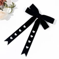 Detail of velvet bow hair clip with pearl heart accents and long ribbons - Black