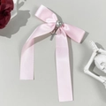 Fermaglio fiocco in raso rosa con strass a cuore e ciondolo a croce in metallo argento - Rosa