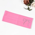 Close-up of bright pink ribbed knit headband with sparkling rhinestone bow detail - Rose Red