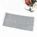 Detail of grey ribbed knit headband with sparkling rhinestone bow on white background - Light Gray