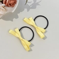 Paire de chouchous à nœuds en satin jaune avec bandes élastiques pour filles mignonnes - Jaune