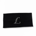Detail showing letter L rhinestone design on black ribbed elastic yoga headband - Letter L Style
