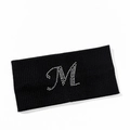 Detail shot of black ribbed knit sports headband featuring silver rhinestone M letter design - Letter M Style
