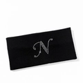Detailed texture of black ribbed headband featuring a sparkling rhinestone letter N - Letter N Style