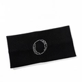 Macro detail of black ribbed knit headband featuring a sparkling silver rhinestone circle - Letter O Style