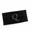 Detail of black ribbed sports headband featuring a sparkling rhinestone letter Q design - Letter Q Style
