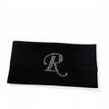 Detail of black ribbed knit headband featuring a sparkling rhinestone letter R design - Letter R Style
