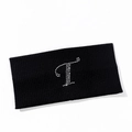 Detailed close-up of a black ribbed knit yoga headband with a rhinestone letter T decoration - Letter T Style