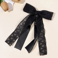 Detailed close-up of a black floral lace bow hairclip with long satin ribbons - Black Lace Satin Mix (7#)
