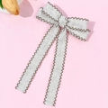 Detail of grey bow hair clip with brown scalloped edges and elegant long ribbons - Long Ribbon Gray With Brown Border