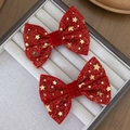 Detail of red velvet bow hair clips with gold star patterns for festive styling - No.2 Pentagram Pattern Style