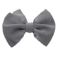 Dettaglio ravvicinato della fascia in nylon grigio con fiocco e trama a coste premium - Accessorio per capelli con fiocco / Grigio