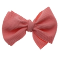 Dettaglio del fiocco rosa in tessuto a nido d'ape per fasce e accessori capelli - Accessorio per capelli con fiocco / Rosso anguria