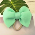 Mint green puffy bow headband for babies made of elastic nylon and space cotton fabric - Mint