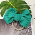 Teal lace bow headband for infants with elastic nylon band on decorative background - Forest Green