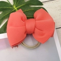 Detailed view of coral orange bow headband for babies with soft elastic band texture - Deep Watermelon Red