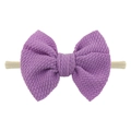 Detailed view of purple waffle texture bow on a beige nylon high-stretch baby headband - Light Purple