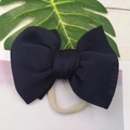 Detail of navy blue puffy bow headband with soft high-elastic nylon strap for infants - Navy Blue