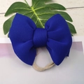Close-up of royal blue bow headband featuring soft elastic nylon strap for infants - Sapphire Blue