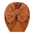 Detailed texture of caramel waffle fabric baby turban hat with large decorative bow - One Size / Coffee