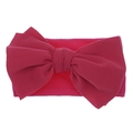 Detail of rose red nylon baby headband featuring a large textured ribbed knit bow - Rose Red