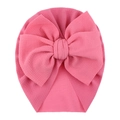 Detailed texture of pink bubble fabric baby hat featuring a large decorative bow - One Size / Pink