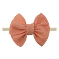 Elastic nylon baby headband featuring a peach pink textured knit bow for infants - Off White