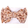 Detailed macro view of vintage floral bow fabric and white elastic baby headband - Beige Floral (KK14-177#)
