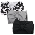 Detailed macro view of three baby headbands with large bows in waffle knit fabric patterns - Cow Grey Black Set (KK14-106+KK01-9+KK01-1)
