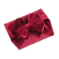 Fascia per neonati con grande fiocco in velluto bordeaux ed elastico su sfondo bianco - Borgogna