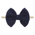 Minimalist baby nylon headband featuring a dark blue textured bow on soft elastic band - Navy Blue