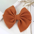 Caramel brown waffle fabric bow hair clip for children with elegant textured finish - Coffee