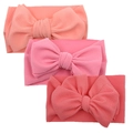 Detailed texture of three baby waffle knit bow headbands in various pink shades - Light Pink Bright Pink Coral Set (DP022-11)