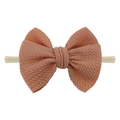 Infant waffle fabric bow headband in salmon pink with stretchable nylon strap - Blush