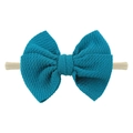 Peacock blue knitted bow headband for babies with soft nylon band on white background - Peacock Blue
