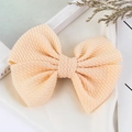 Handmade large peach bow hair clip in textured ribbed fabric for girls and infants - Off-white