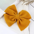 Handmade ginger yellow bow hair clip with textured fabric for kids and babies - Turmeric