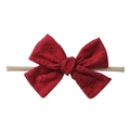 Detailed eyelet embroidery on dark red cotton bow headband with soft nylon cord - Burgundy