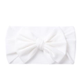 Detail view of a soft white knitted baby headband with a large handmade bow decoration - White