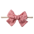 Close-up of pink cotton bow with floral embroidery on soft nylon baby headband - Pink