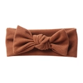 Detailed texture of caramel brown soft cashmere-like bow headband for infants - Coffee