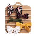 Detail of five elastic baby headbands with floral, sequin, and lace bows on a display card - Green Purple Floral Sequin Combination (DP061-1)