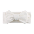 Detail view of a white ribbed knit baby headband with a large decorative bow - White