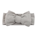 Detailed close-up of ribbed fabric texture on a soft grey infant bow headband - Light Gray