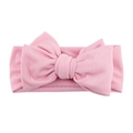 Close-up of pink ribbed cotton baby headband featuring a large soft bow and elastic texture - Light Pink