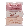 Detailed macro view of 3-piece baby bow headbands featuring floral and solid patterns - Pink Floral and Apricot Combination (DP070-2)