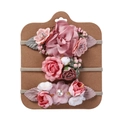 Detailed close-up of three handmade floral baby headbands on a kraft display card - Pink and White Floral Style (DP064-1)