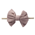 Close-up of baby nylon headband with a soft Morandi pink ribbed knit bow detail - Khaki