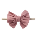Detail of baby headband with soft ribbed purple bow and elastic nylon band for infants - Coffee